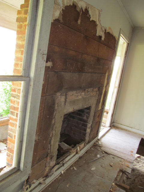 old brick fireplace and rough-sawn walls