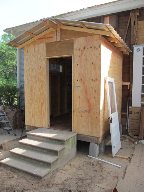 Mudroom window installed and mudroom cladded in plywood