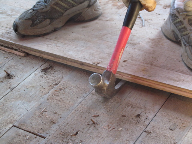 removing the oak floors, one board at a time