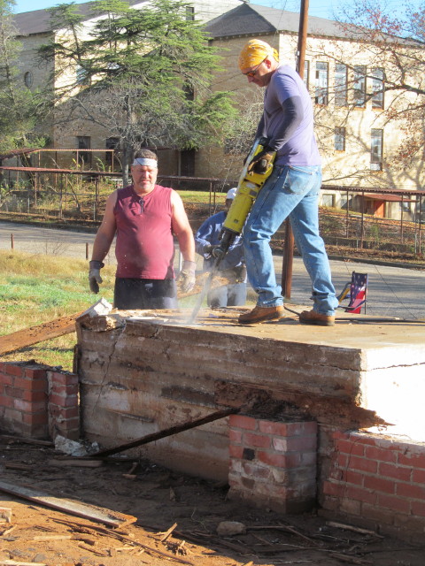 jackhammering the concrete porch