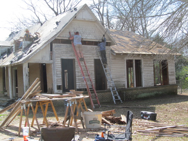 Mark and Simon removing siding