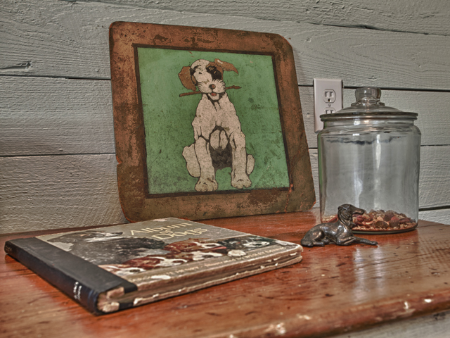 Living Vintage - display of dog treats and dog collectibles in mudroom