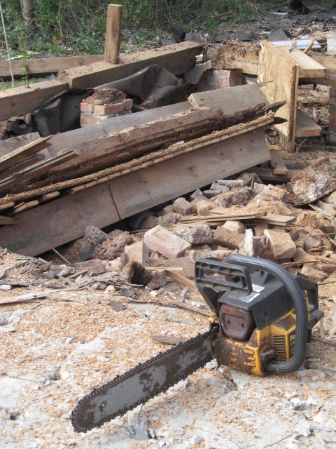 using a chainsaw to remove rotten wood