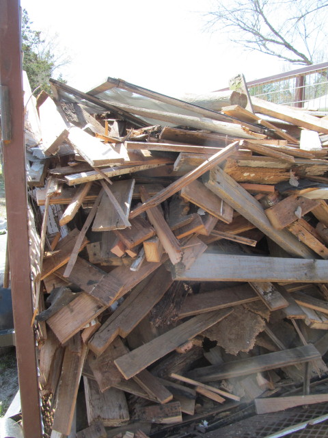 lumber moved from burn piles to trash trailer