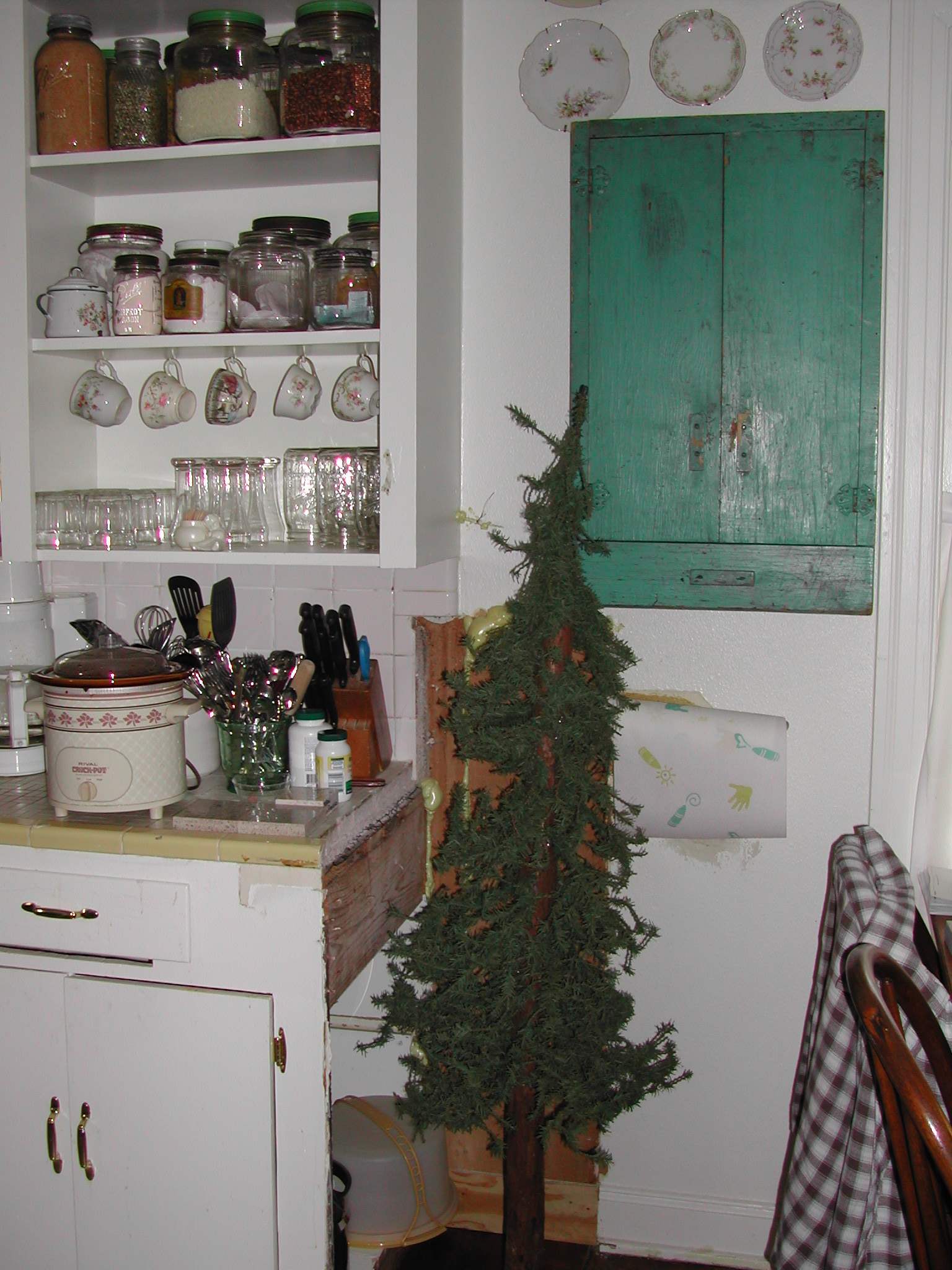 Ruth Avenue kitchen - before - Charlie Brown tree hiding terrible patch job