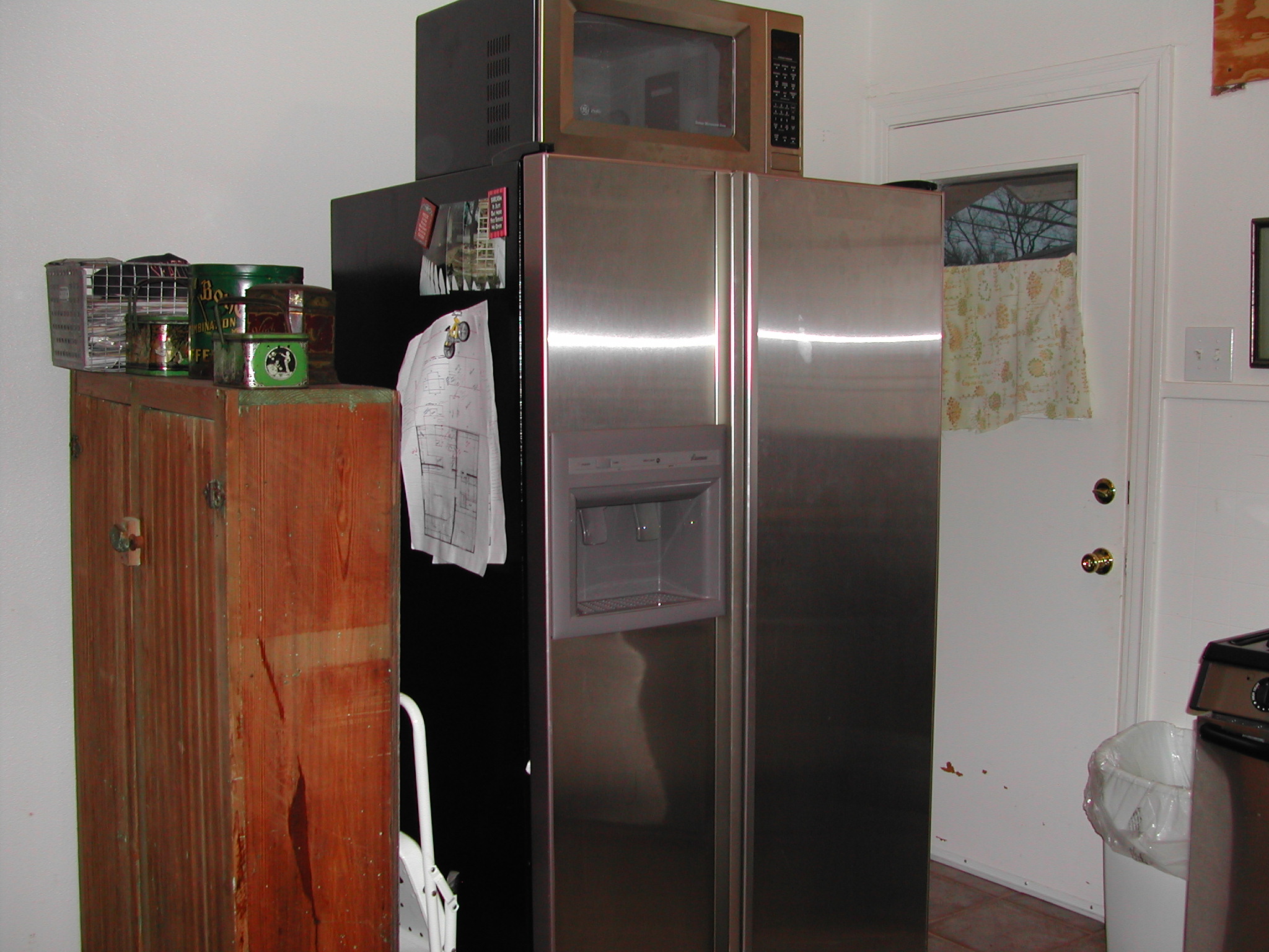 Ruth Avenue kitchen - before - door in the corner and an old cabinet for a pantry