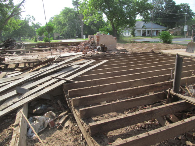 a pile of old pine floors ready to be de-nailed