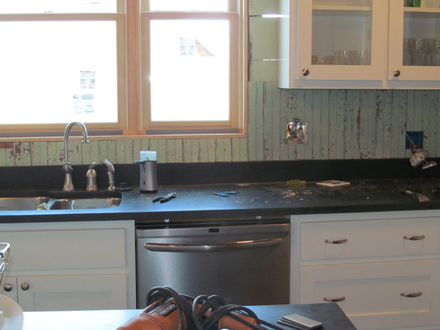 about a third of the reclaimed beadboard backsplash installed in our kitchen