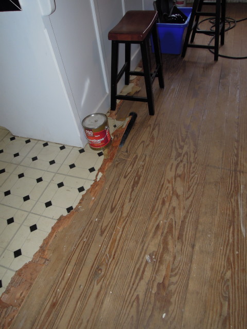 removal of old lineoleum reveals old hardwood floors