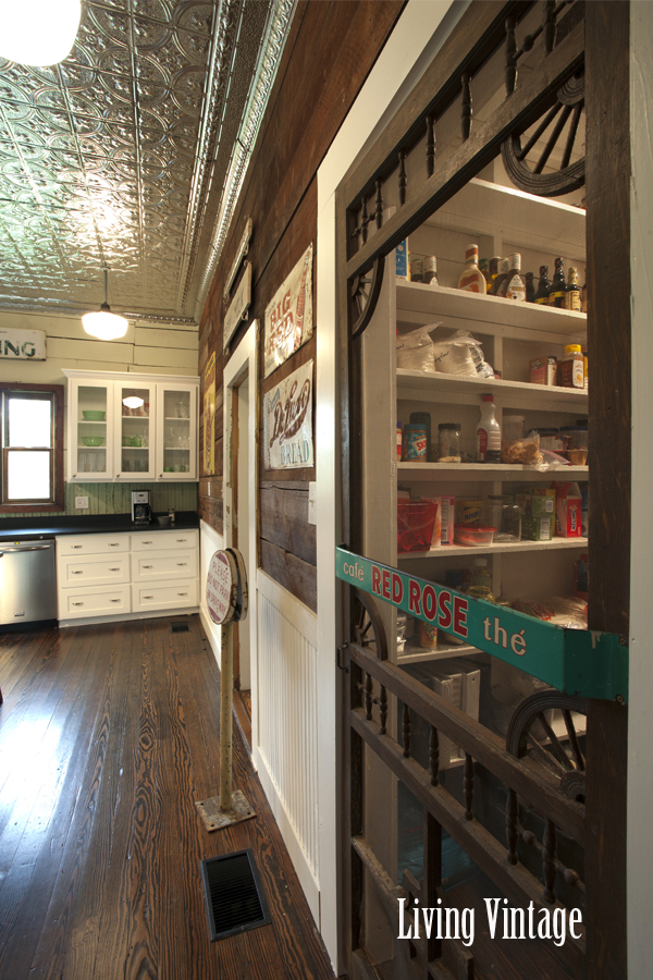 Living Vintage kitchen reveal - walk-in pantry with reclaimed screen door and old push pull sign