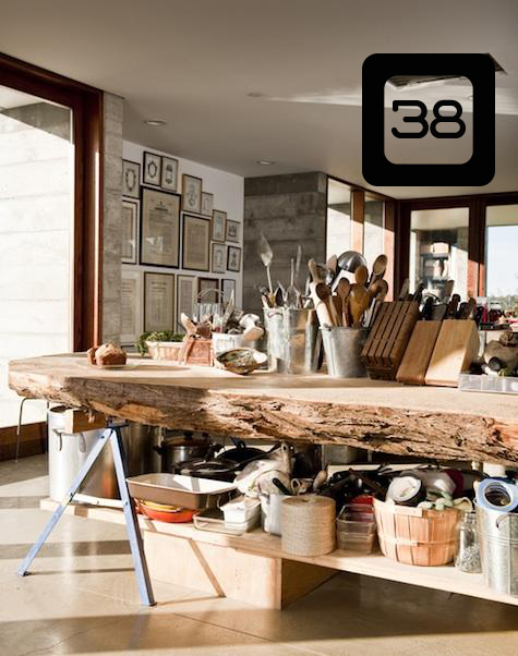 a kitchen island using sawhorses and a slab of wood cut from a large stump