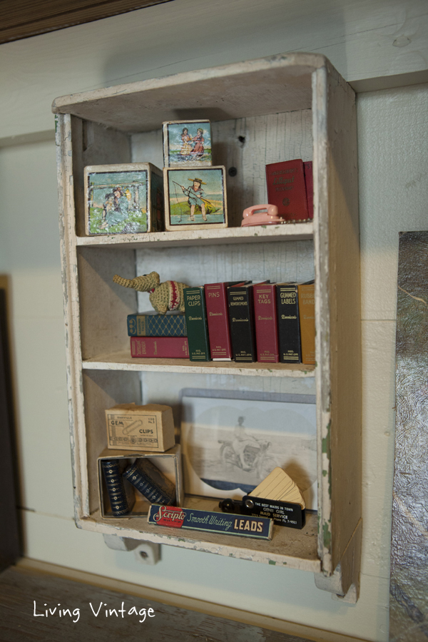 a little cabinet we saved from an old house we salvaged and some miniatures I collect - Living Vintage