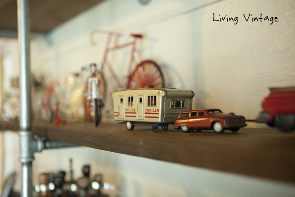 closeup of collectibles on my husband's office shelves - Living Vintage