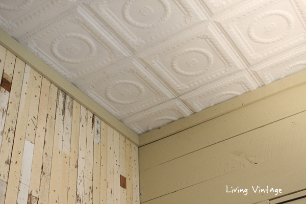 a view of our tin ceilings, our accent wall and painted wood plank walls - Living Vintage