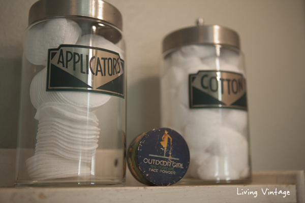 close-up of apothecary jars and vintage face powder