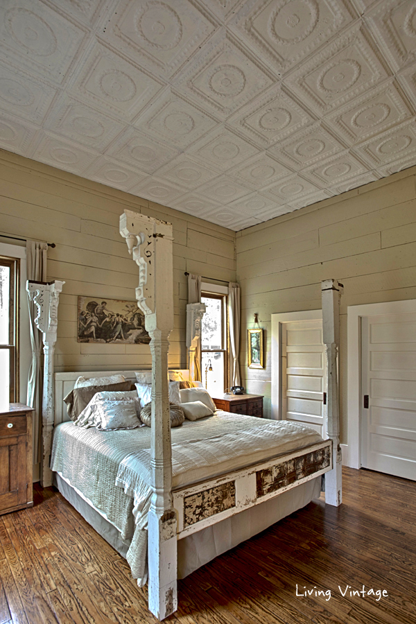 our bed made with porch posts, old doors and reclaimed tin, plus our tin ceiling - Living Vintage