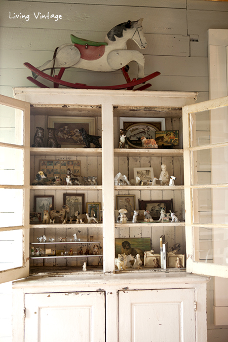 the cabinet where my dog collectibles are displayed -- head on over to see our living room reveal - Living Vintage