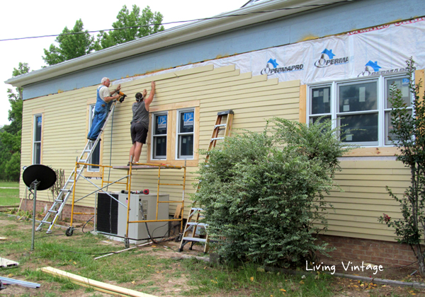Mark and Mike installing new siding and trim