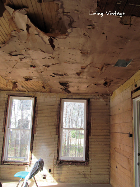 yellow beadboard discovered under paneling and old cheesecloth wallpaper - Living Vintage