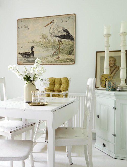 an (almost) stark white dining room with a fabulous illustration - one of 8 picks for this week's Friday Favorites - Living Vintage