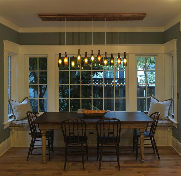 a clever pendant light using old bottles and a reclaimed shutter