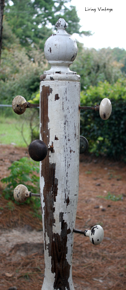 a jewelry tree using an old porch post, a reclaimed finial, some old doorknobs, and a few pieces of reclaimed wood 