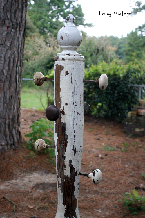 a jewelry tree using an old porch post, a reclaimed finial, some old doorknobs, and a few pieces of reclaimed wood 