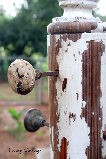 a jewelry tree using an old porch post, a reclaimed finial, some old doorknobs, and a few pieces of reclaimed wood 