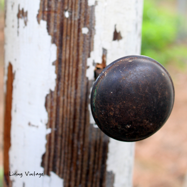 a jewelry tree using an old porch post, a reclaimed finial, some old doorknobs, and a few pieces of reclaimed wood 