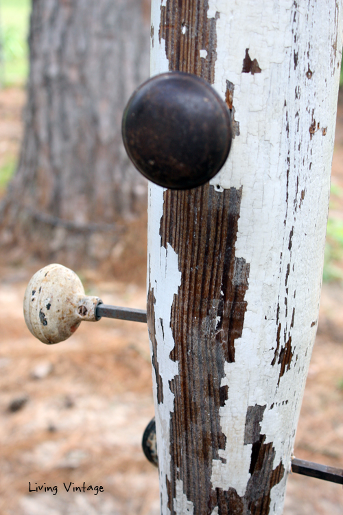 a jewelry tree using an old porch post, a reclaimed finial, some old doorknobs, and a few pieces of reclaimed wood 