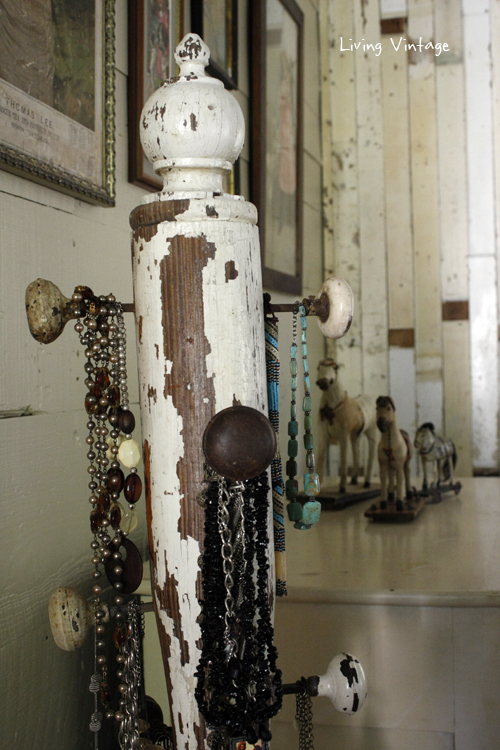 a jewelry tree using an old porch post, a reclaimed finial, some old doorknobs, and a few pieces of reclaimed wood 