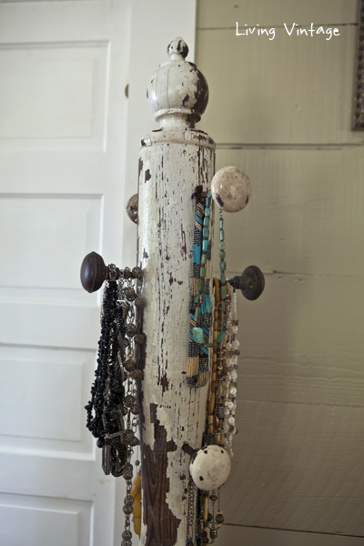 a jewelry tree using an old porch post, a reclaimed finial, some old doorknobs, and a few pieces of reclaimed wood 