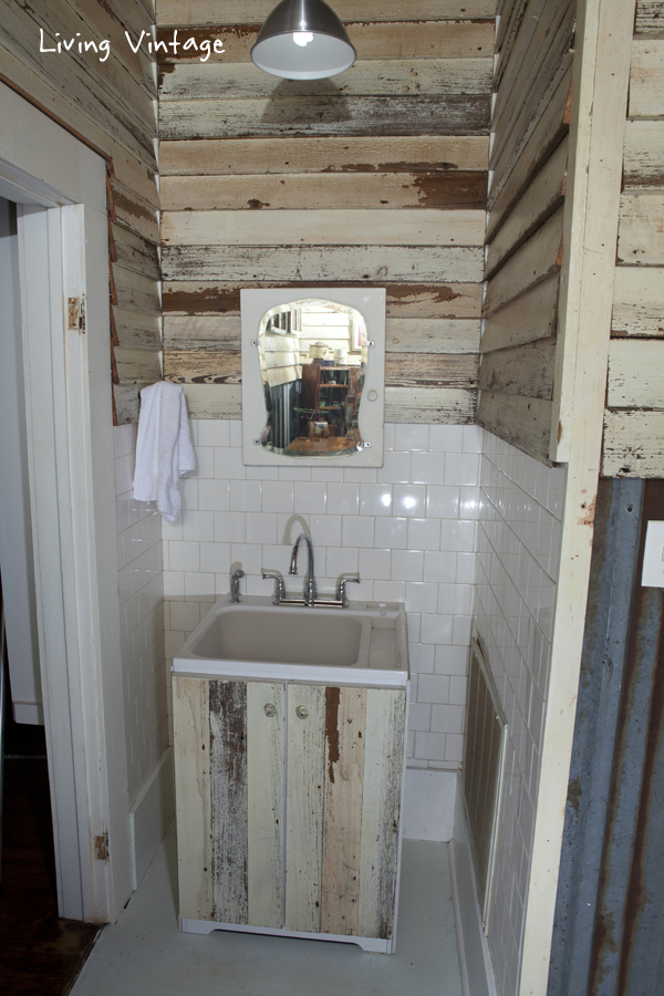 a cheap laundry sink clad in reclaimed siding