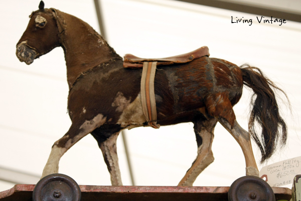 an antique horse pull toy