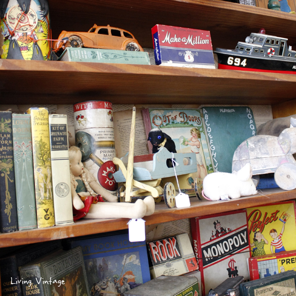 (cropped) a wide assortment of children's toys and books in Two Sisters Antiques booth