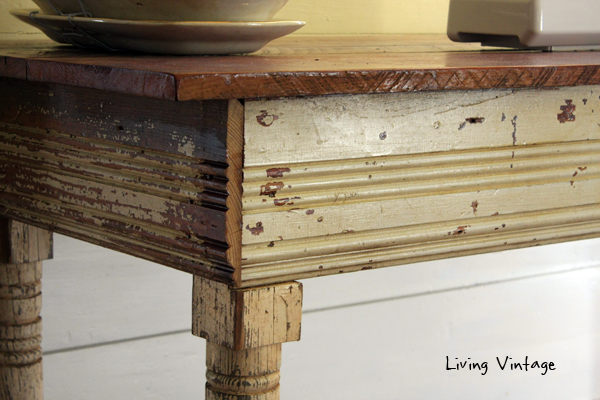 a gorgeous sewing table made using reclaimed table legs, wood, and trim