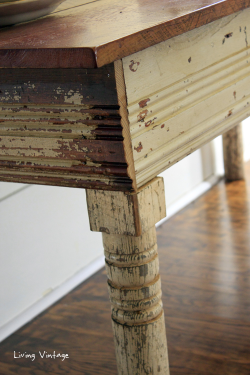 a gorgeous sewing table made using reclaimed table legs, wood, and trim