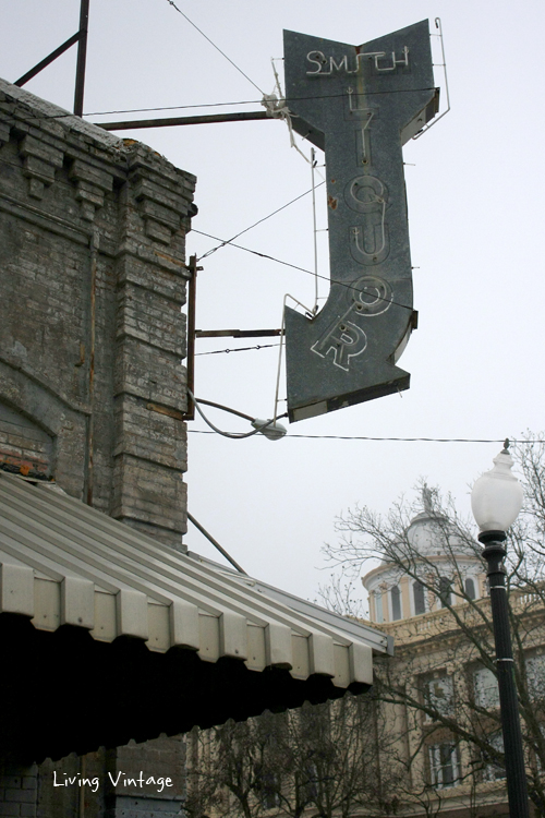 an old neon liquor sign