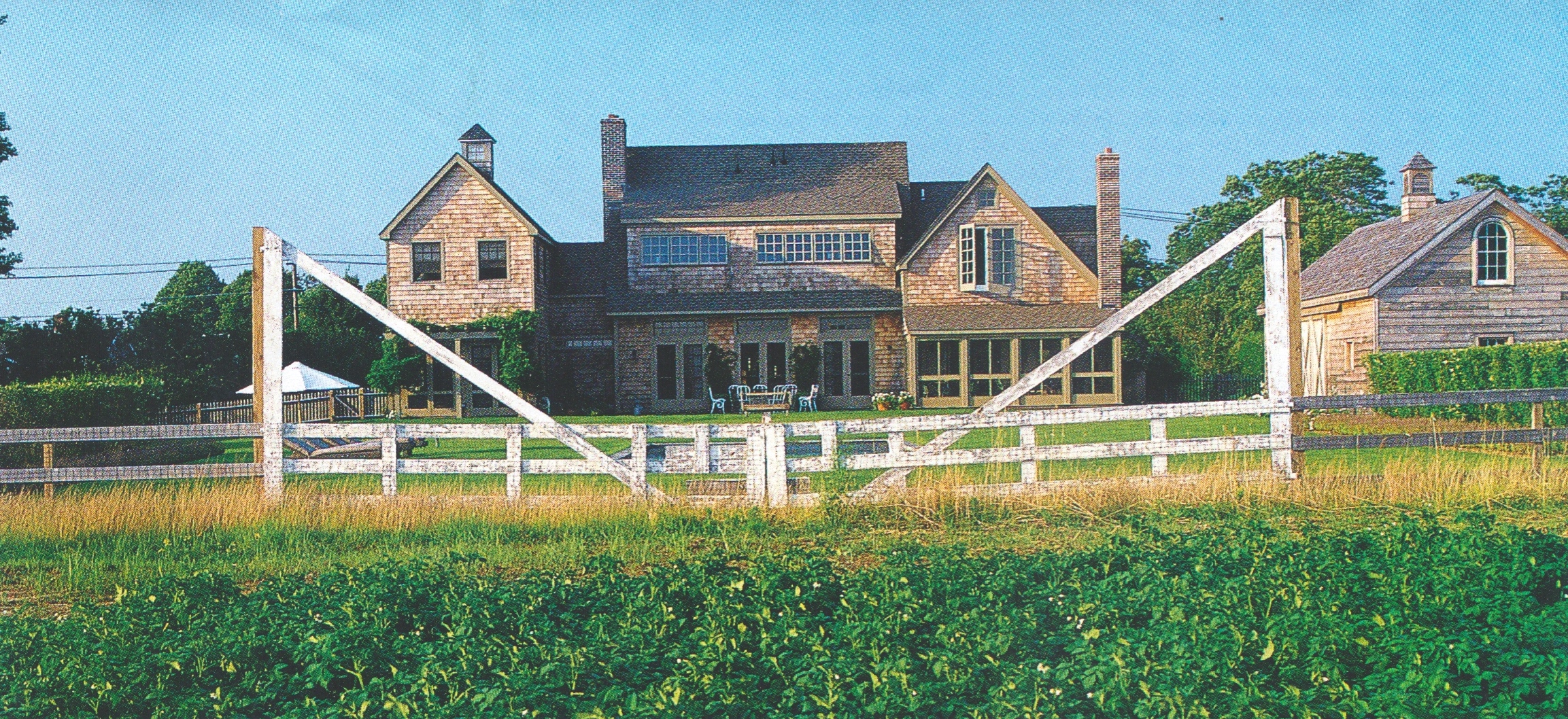 a neat entry gate separating the field from the homestead