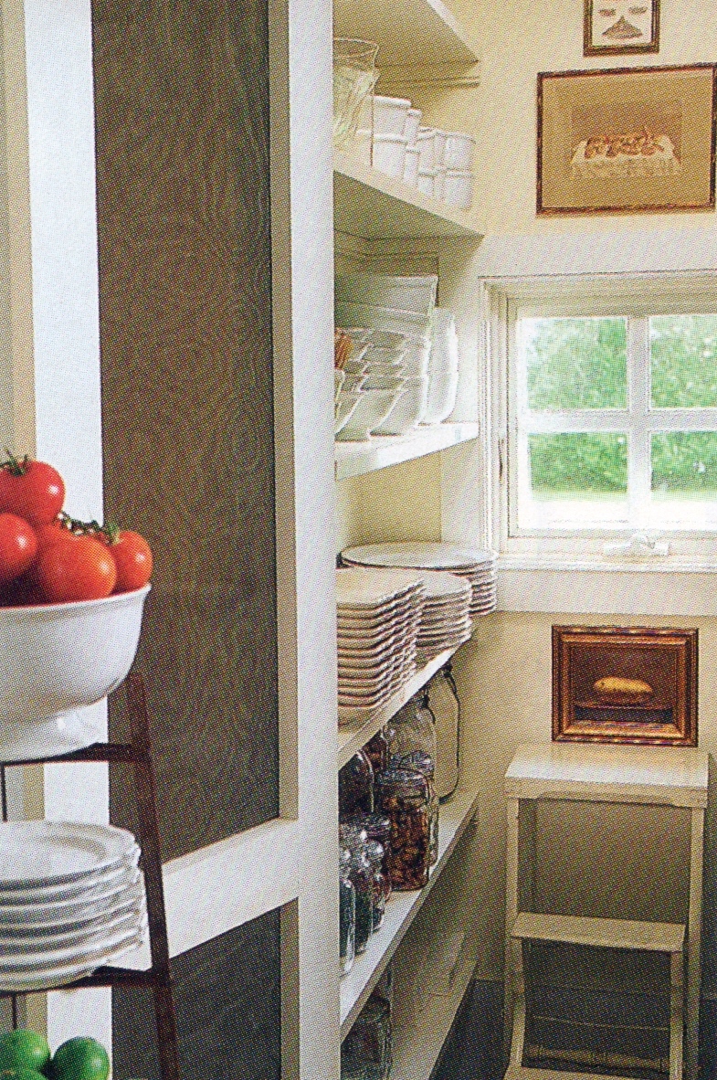 a nice walk-in pantry keeps serving dishes at the ready