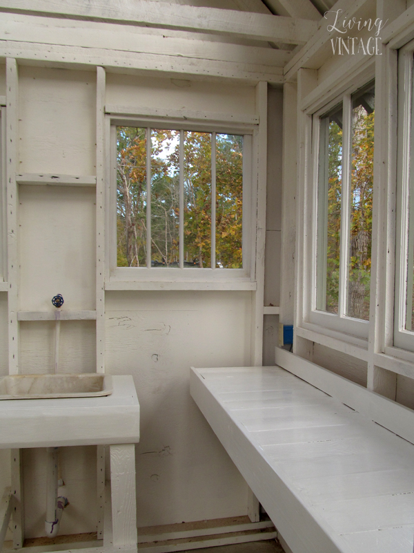 numerous reclaimed windows in this cute little greenhouse - see more photos @ Living Vintage