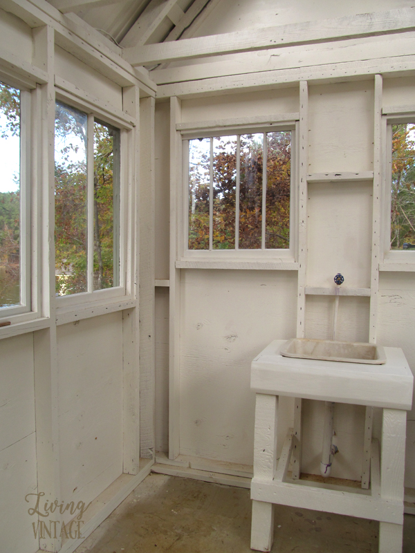 numerous windows and a sink in this cute little greenhouse - see more photos @ Living Vintage
