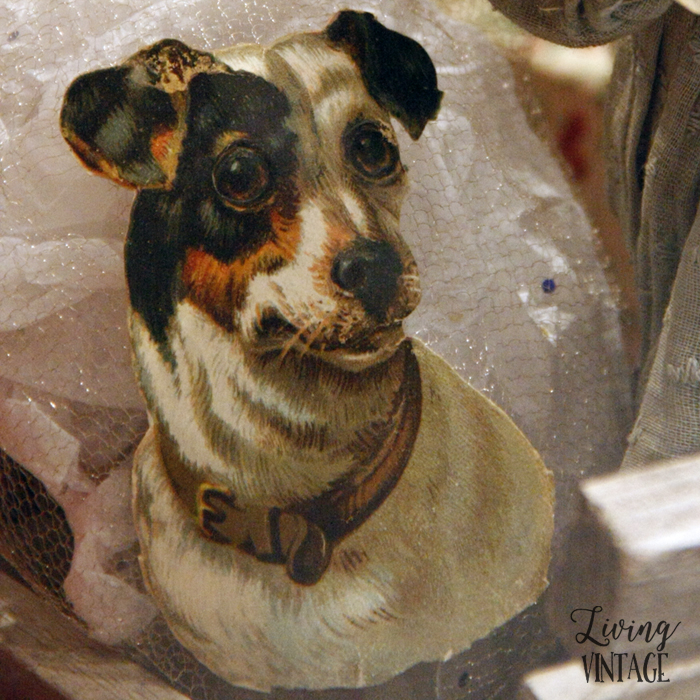 a jack russell illustration, part of an elaborate display of antique Christmas collectibles